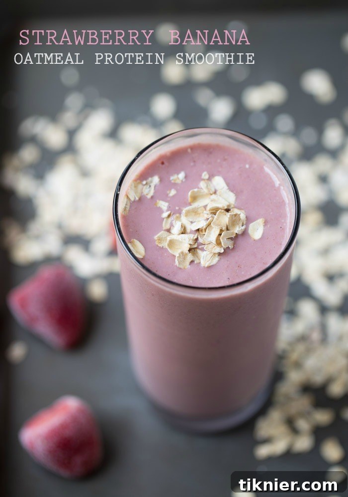 A refreshing Strawberry Banana Oatmeal Protein Smoothie in a glass
