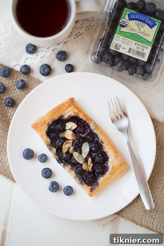 Platter of homemade Blueberry Brie Pastry Tarts, ready to serve for brunch or breakfast.