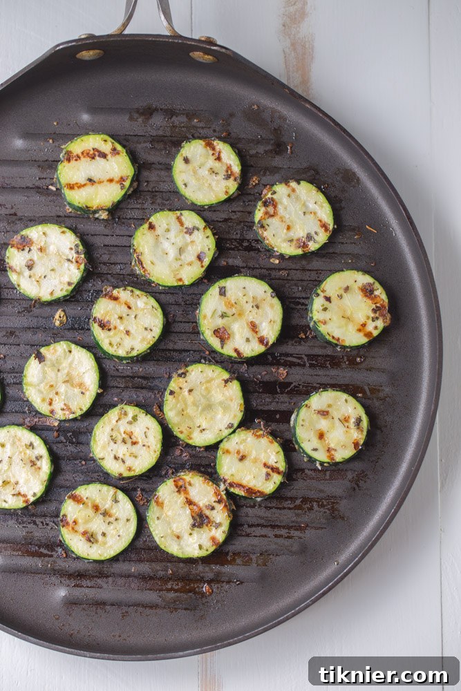 Garlic Parmesan Herb Zucchini. A healthier side dish alternative with no sugar and only 83 calories per serving! | This Gal Cooks