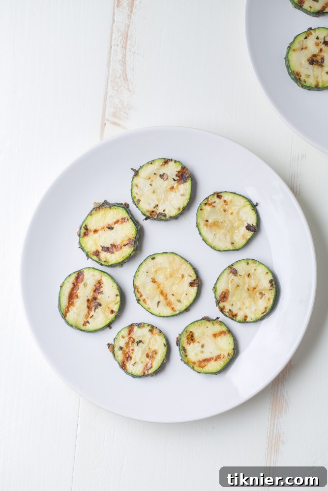 Garlic Parmesan Herb Zucchini. A healthier side dish alternative with no sugar and only 83 calories per serving! | This Gal Cooks