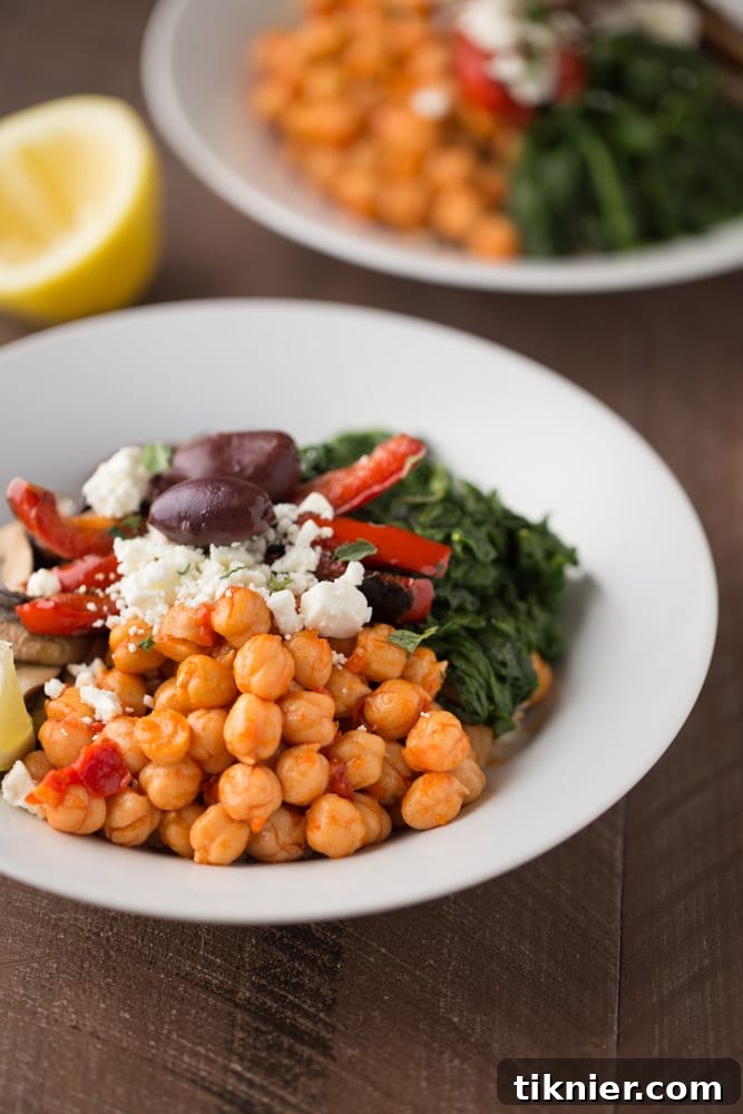 Close-up of a vibrant Mediterranean Veggie Rice Bowl, showcasing fresh ingredients.