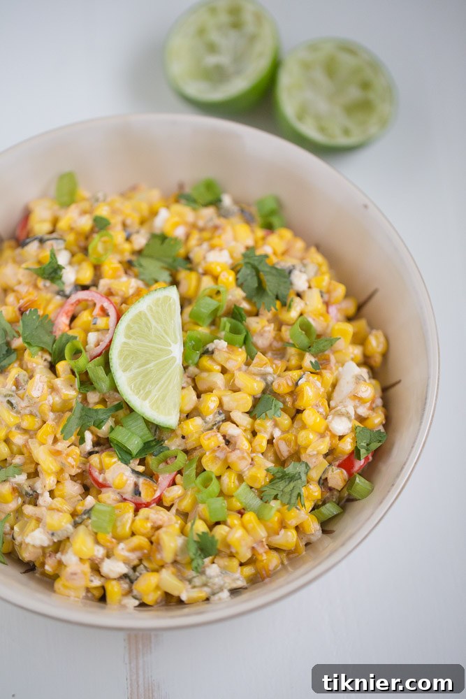 Close-up of freshly made Street Corn Salad with charred corn, peppers, and queso fresco