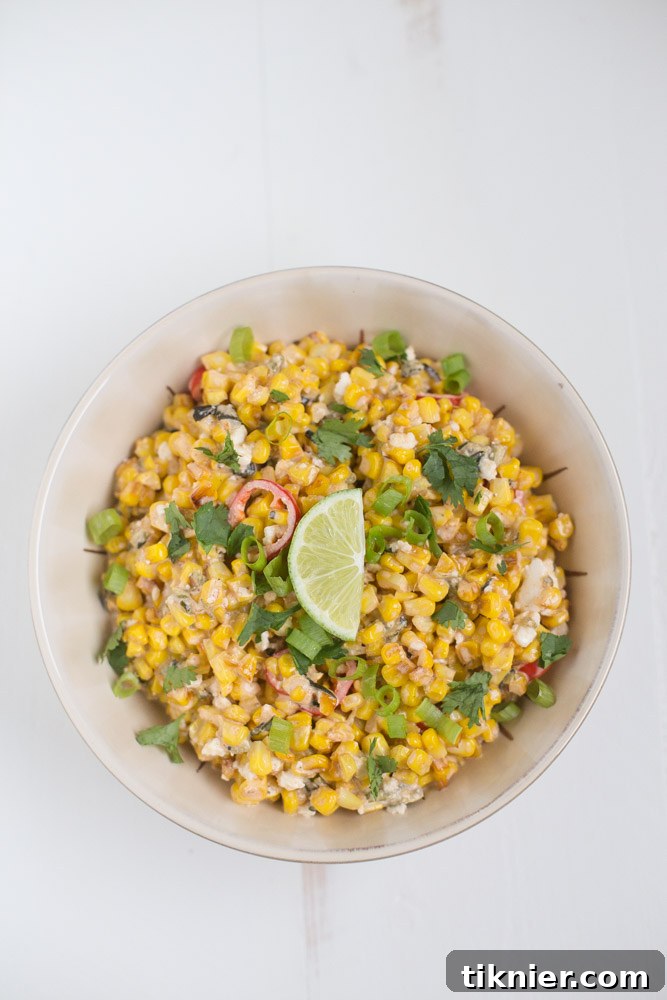 Close-up of a serving of Street Corn Salad garnished with fresh cilantro