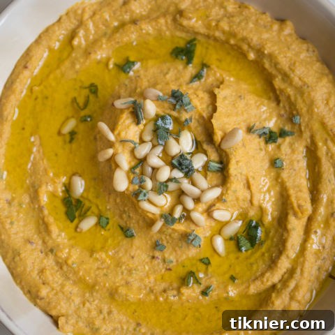 Pumpkin Hummus with Sage + Cranberries - A delightful fall recipe.