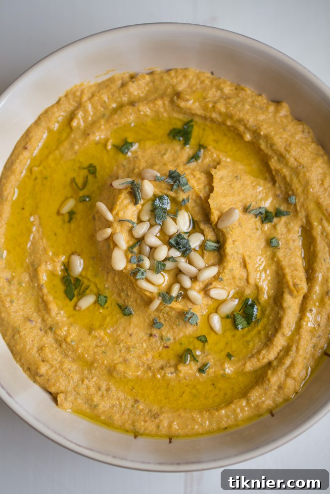 Pumpkin Hummus with Sage and Cranberries is an ideal appetizer for autumn gatherings, offering bold flavors and a healthy option for entertaining.