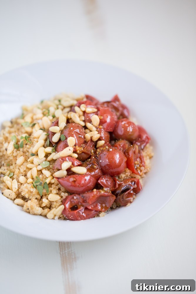 Effortless Vegan Roasted Tomato Quinoa Bowl 2 Healthy and Quick Quinoa Bowl with perfectly roasted cherry tomatoes, crunchy pine nuts, and aromatic fresh thyme for a delicious vegan meal.