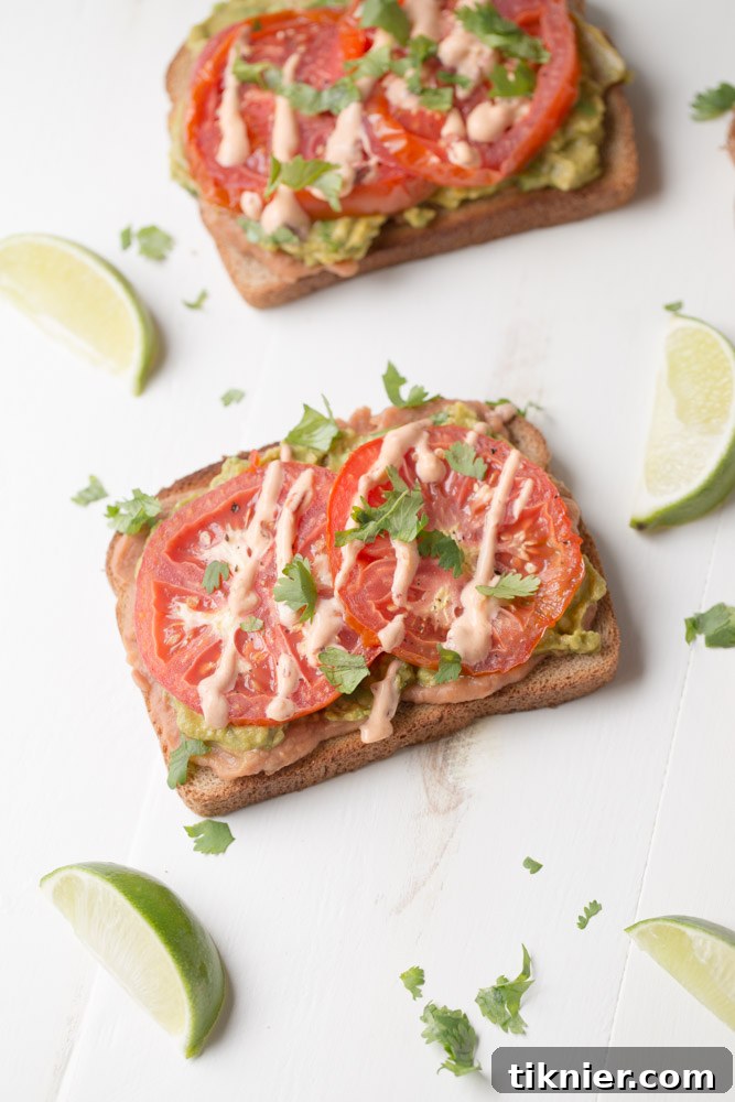 Fresh Avocado Tomato Toast, a healthy and satisfying vegan breakfast or brunch option.