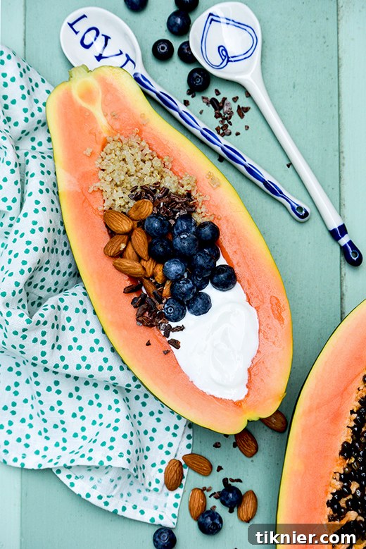 Exotic Papaya Quinoa Breakfast Bowl, a refreshing and nutritious vegan-friendly morning meal.