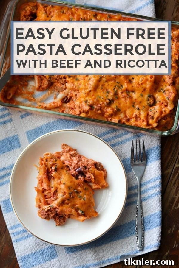 A close-up shot of a steaming, golden-brown Easy Gluten-Free Pasta Casserole, garnished with fresh herbs, showcasing melted cheddar cheese and hearty ingredients.