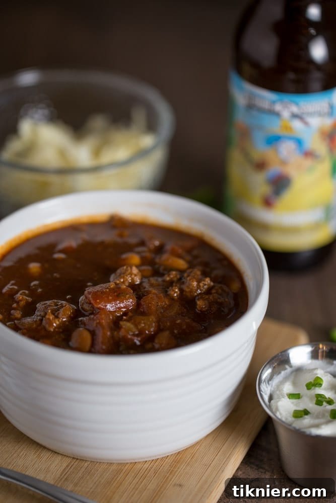 Overhead shot of Stout Beer Chili in a bowl, showcasing its rich texture and inviting warmth.