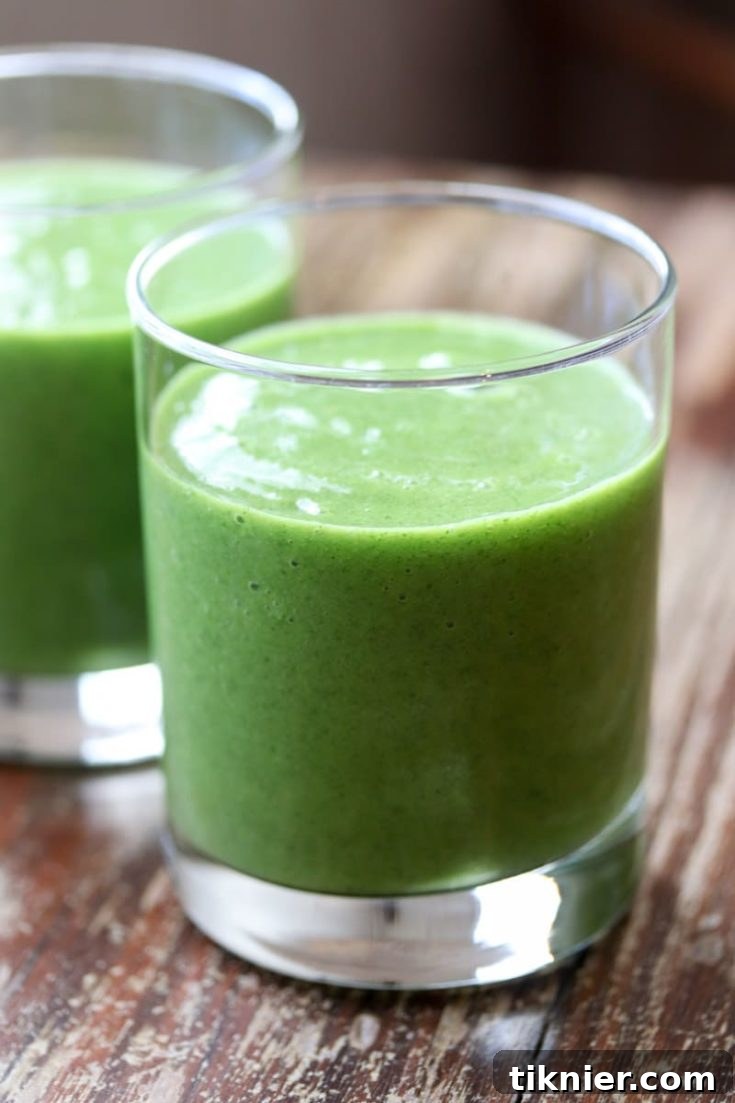 Tropical Mango Pineapple Kale Smoothie, a delicious and healthy drink idea.