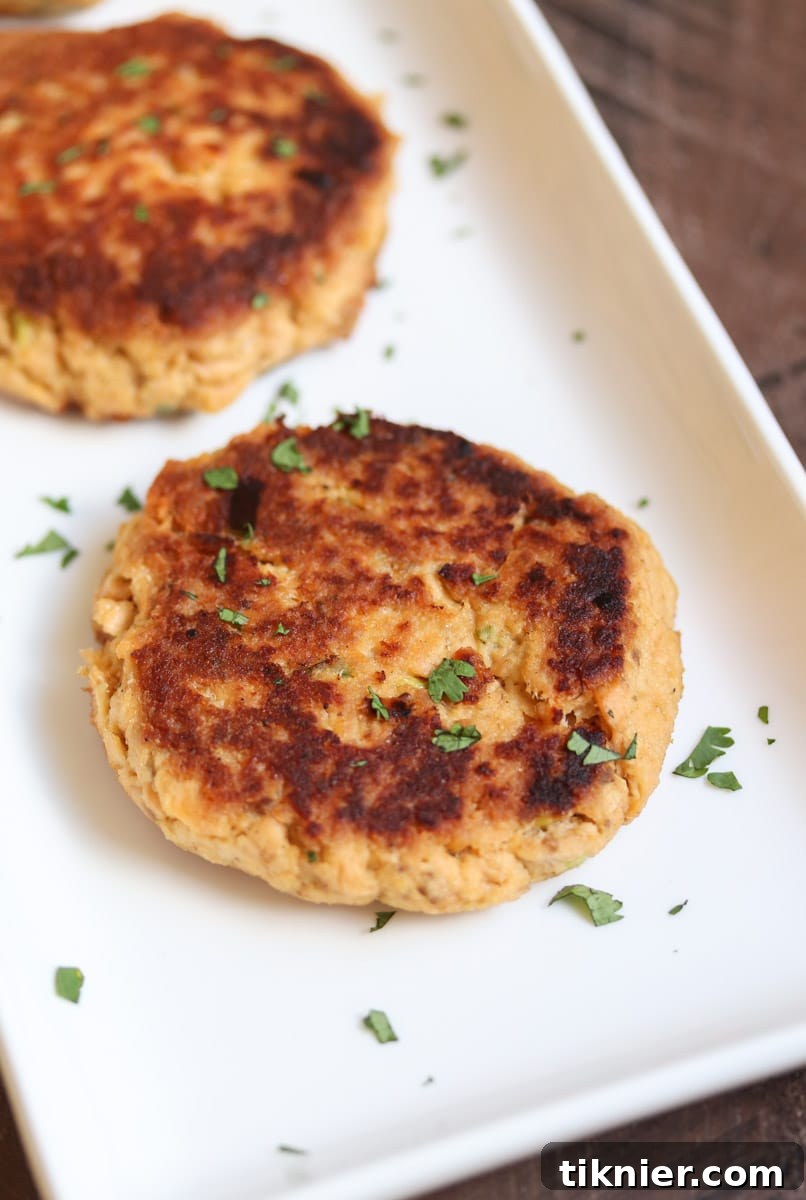 Effortless Paleo Salmon Cakes Low Carb Dairy Free 2 The easiest salmon cakes you'll ever make! These paleo salmon cakes are made with canned salmon, paleo mayo, spices, and almond flour! Serve them as an appetizer or with your favorite veggie for a complete healthy meal. #paleo #salmon #savory #dinner #appetizer