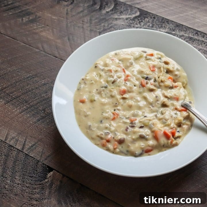 A vibrant image of Turkey Wild Rice Soup, a perfect recipe to use leftover turkey and fresh herbs from your holiday feast.