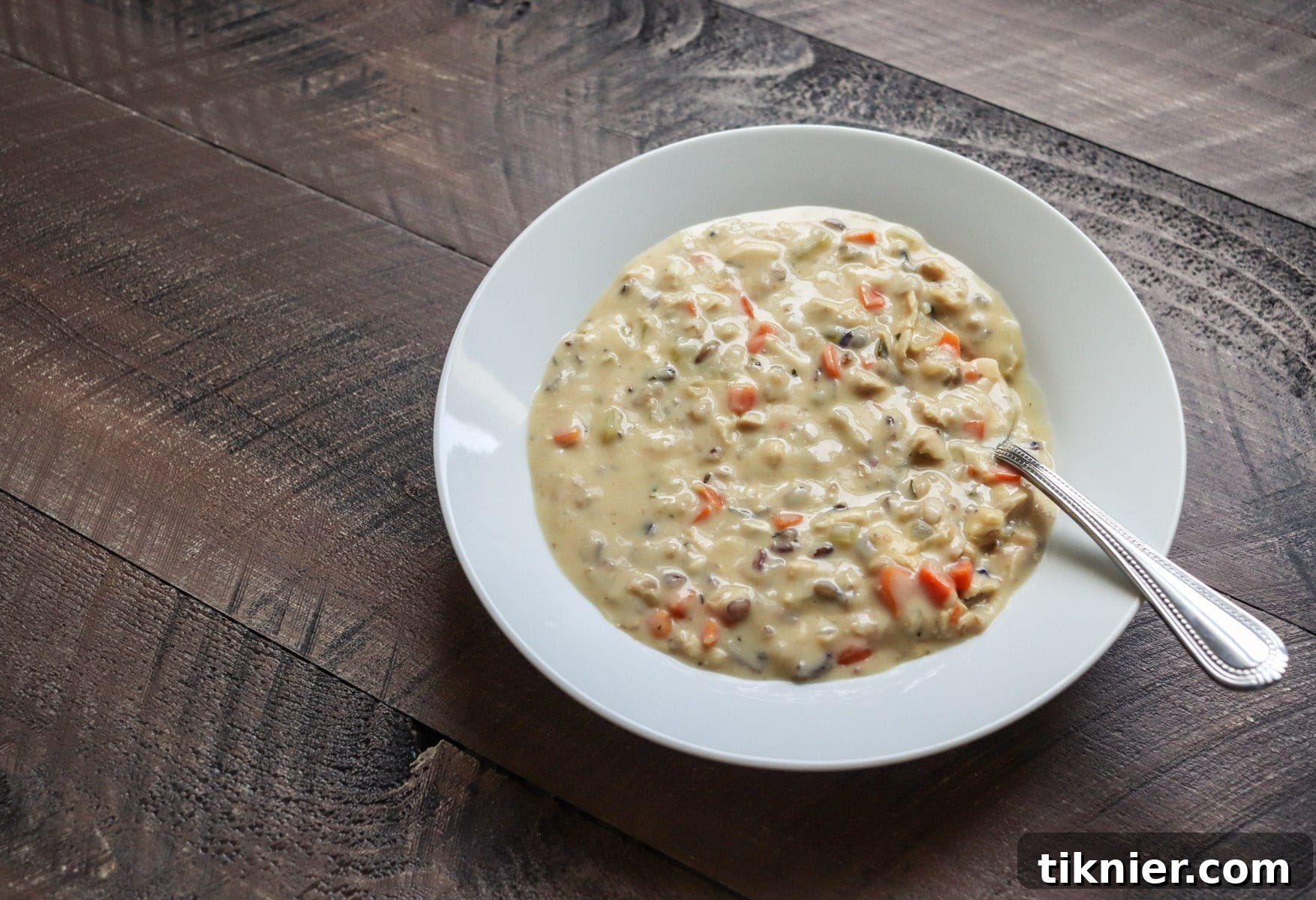 An overhead shot of a large pot of Turkey Wild Rice Soup, ready to be served, showcasing its rich texture and wholesome ingredients.