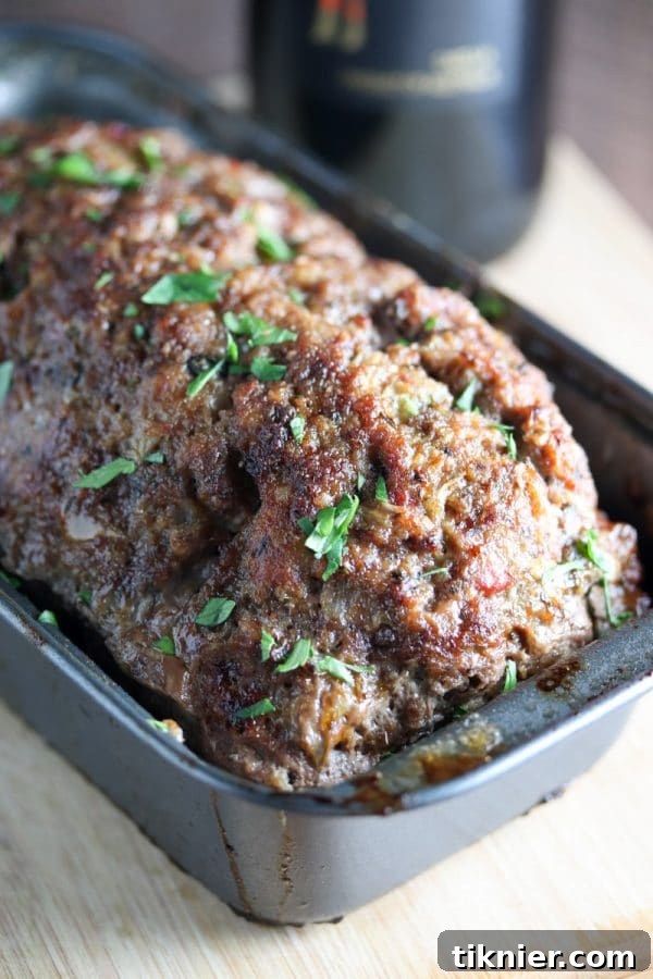 Red Wine Meatloaf is full of BOLD flavors and is one of my favorite dinner recipes! Super easy to make and incredibly great for leftovers! Infused with Cabernet Sauvignon for a rich, savory taste. #meatloaf #redwinerecipe #comfortfood #easydinner #mealprep