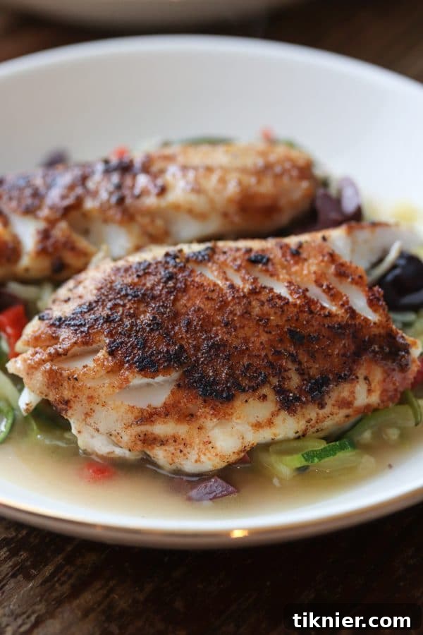 Pan Seared Black Sea Bass with Zucchini Noodles, a delicious and healthy seafood dinner. Perfect for low carb, gluten free, and keto diets. Easy to make in under 30 minutes! #seafood #seabass #lowcarb #glutenfree #dinner #keto #healthydinner