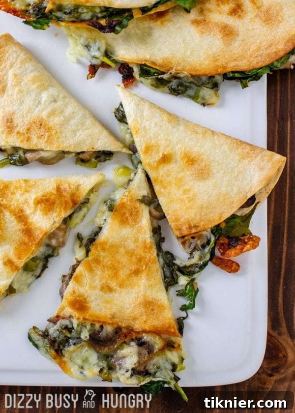 Crispy Baked Spinach and Mushroom Quesadillas, golden brown and filled with savory ingredients, a healthy dinner option.