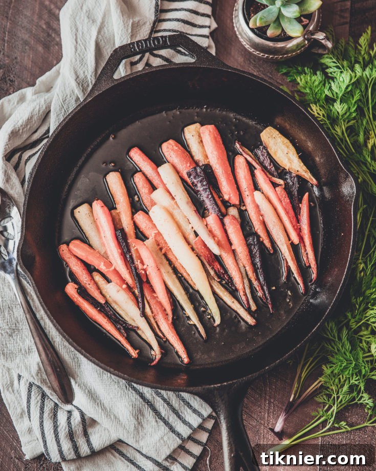 Artfully arranged roasted rainbow carrots, highlighting their natural colors and caramelized edges, ready for a delicious meal.