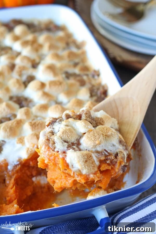 Decadent Sweet Potato Casserole with toasted marshmallows and a pecan streusel topping, a holiday favorite.