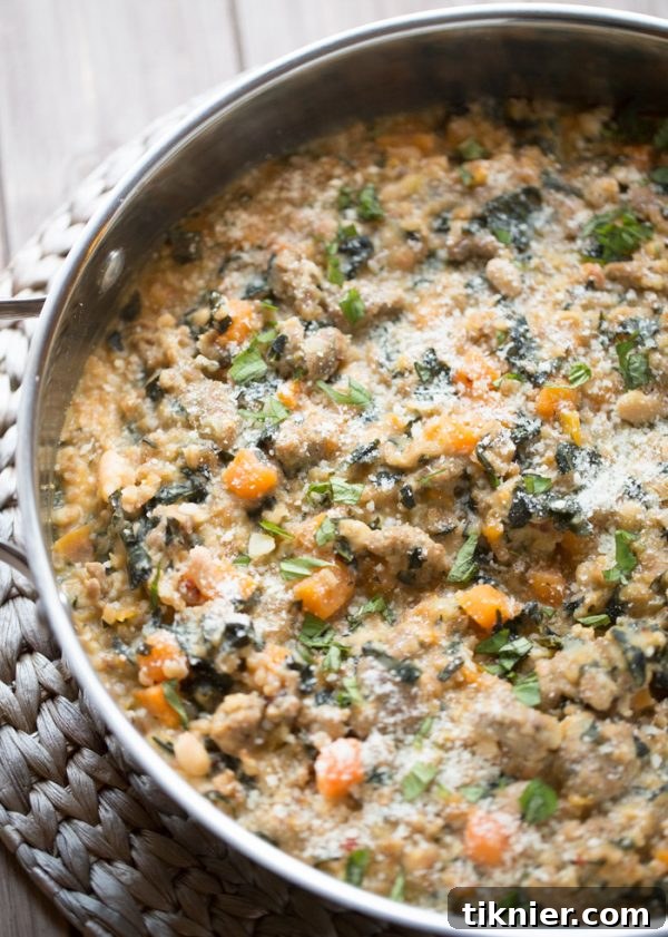 Skillet Farro and Turkey Sausage Casserole with sweet potatoes, kale, and white beans, made in one pan.