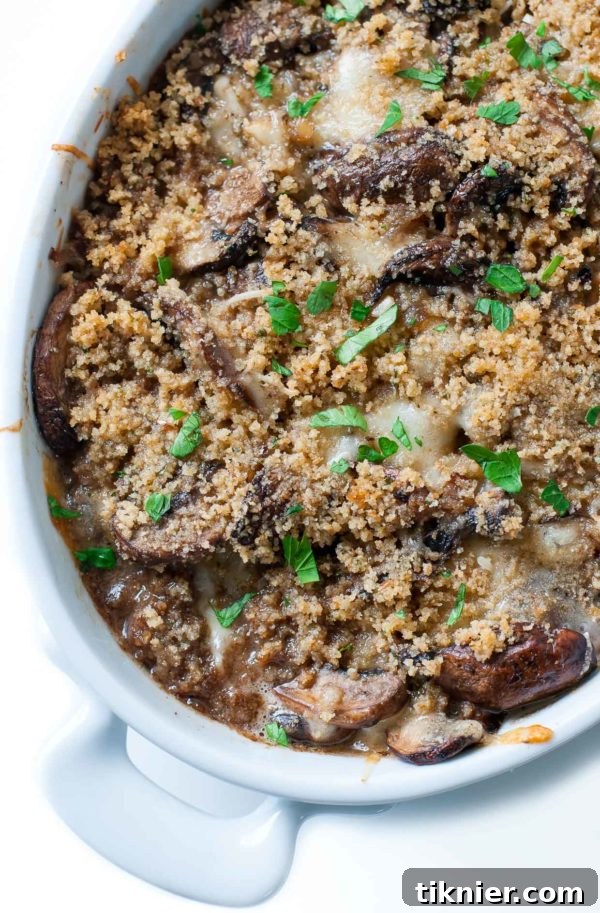 Rich Stuffed Mushroom Casserole topped with crispy golden breadcrumbs, ideal for holidays.