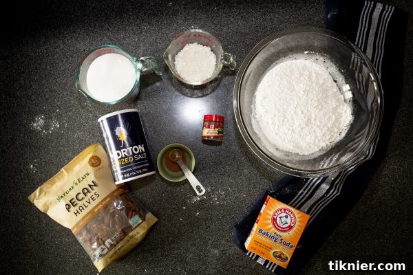 Whisking dry ingredients in a large mixing bowl.