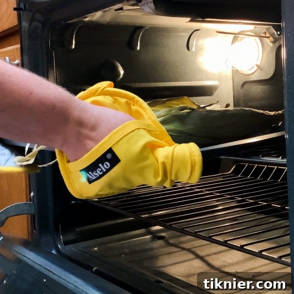 Remove the roasted corn from the oven after baking