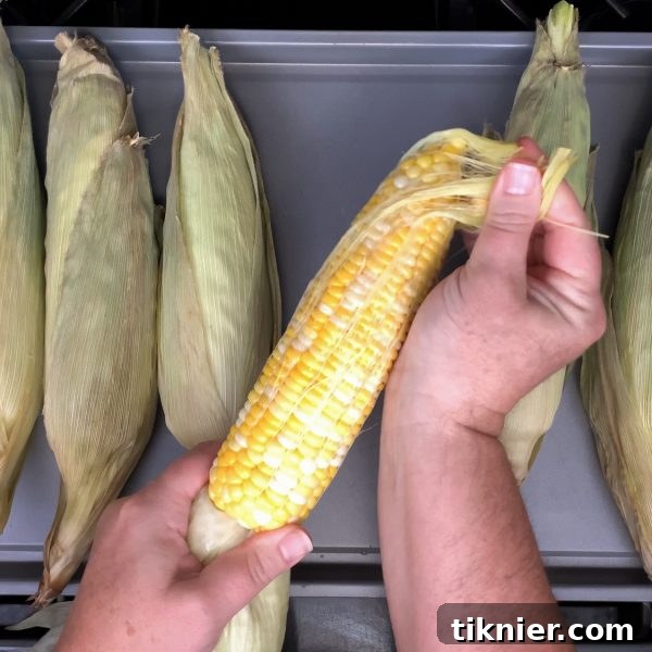 Remove the silk from the corn after cooking