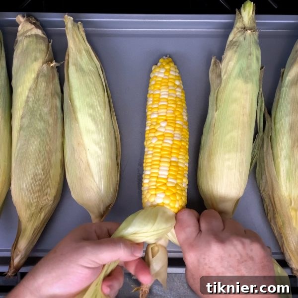 Tie the corn husks with an overhand knot for a handle