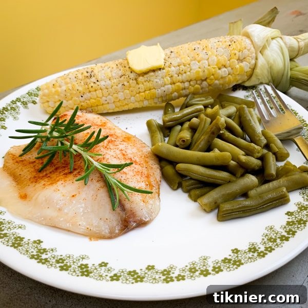 Oven-roasted corn on the cob served with green beans