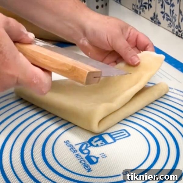 Irresistible Chess Pie 16 pie dough gently folded into a triangle shape, ready for transfer