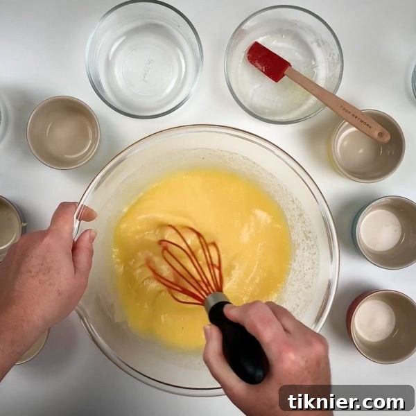 Irresistible Chess Pie 22 a whisk vigorously mixing chess pie filling ingredients