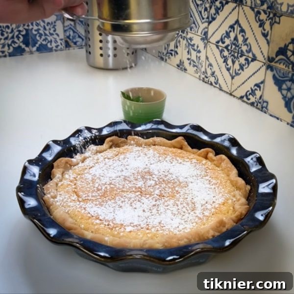 Irresistible Chess Pie 26 a finished chess pie dusted with powdered sugar and garnished with mint