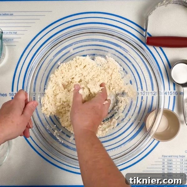 Irresistible Chess Pie 4 rolling out homemade pie dough on a floured surface