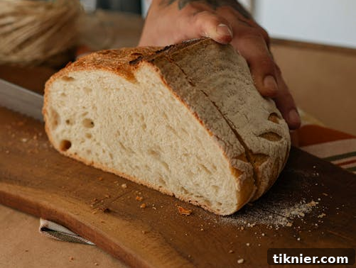 My Five-Year Refined Sourdough Recipe 6 Sliced sourdough bread with butter and fresh herbs