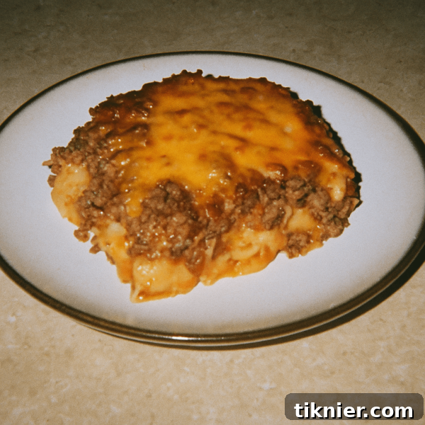 A hearty and cheesy Poor Man's Husband Casserole with a golden, crunchy topping, ready to serve.