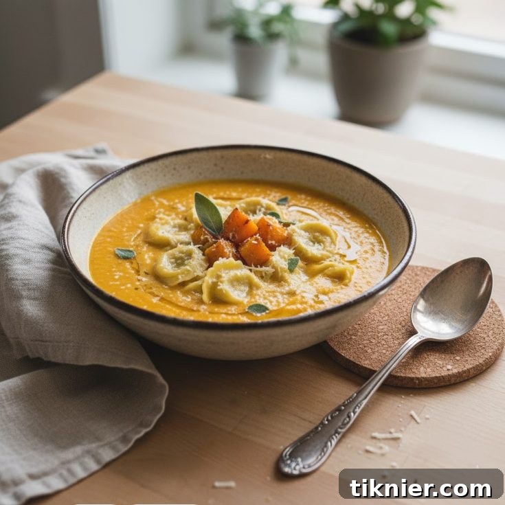 Close-up of roasted butternut squash soup, garnished with sage