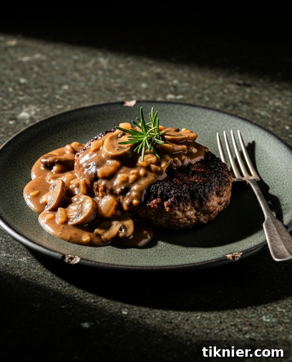 Classic Salisbury Steak with rich mushroom gravy served over mashed potatoes