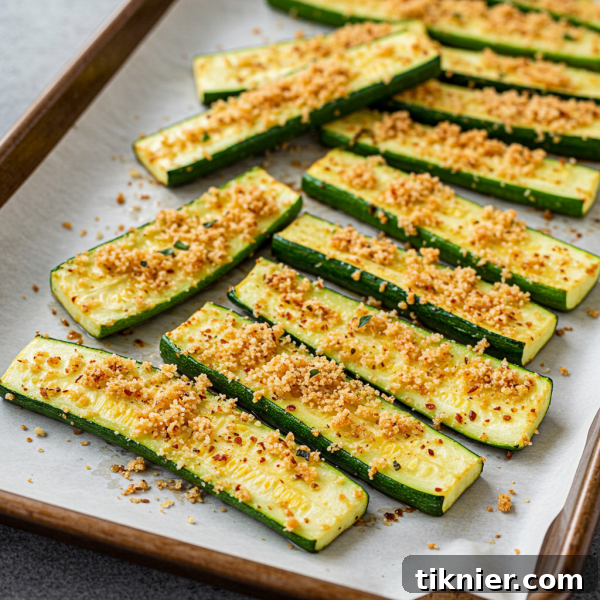 Quick and Tasty Roasted Zucchini Perfection 3 Close-up of golden brown roasted zucchini with Parmesan panko topping.