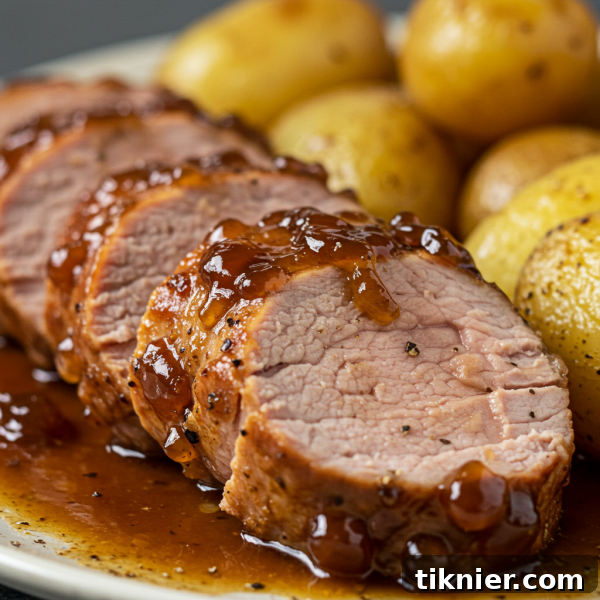 Glistening smoked pork tenderloin medallions with peach bourbon glaze