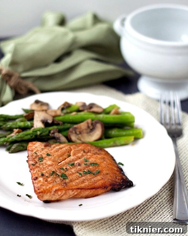 Teriyaki Salmon with Sesame Asparagus. Healthy and super simple to make! From www.thisgalcooks.com
