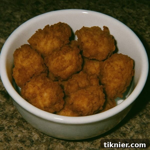 Whip Up Perfect Chick-fil-A Style Nuggets at Home 2 Homemade Chick-fil-A Chicken Nuggets served with sauce and waffle fries