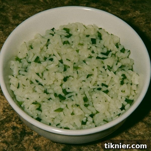 Flavorful Chipotle Cilantro Lime Rice, ready to serve with a garnish of fresh lime and cilantro