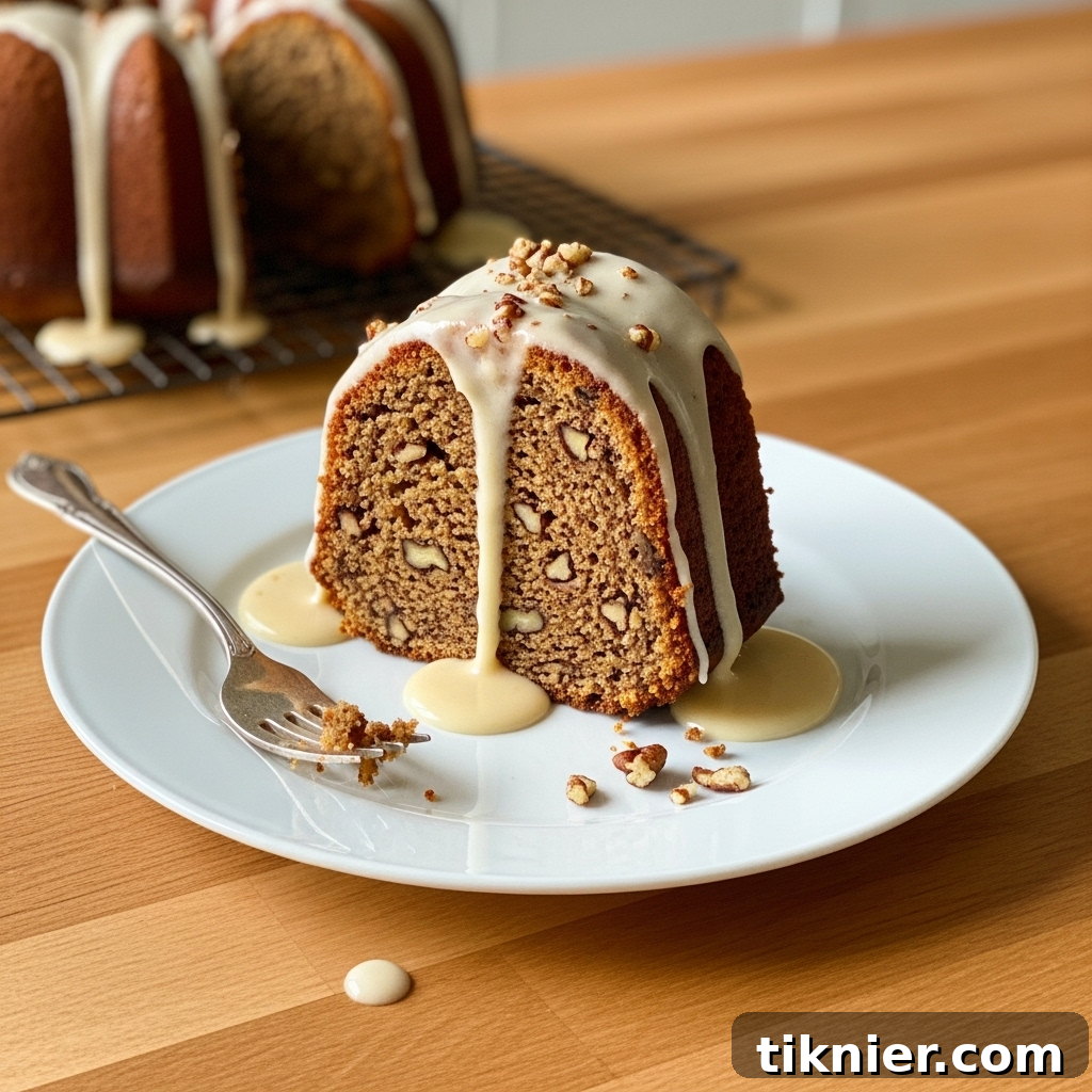 A close-up shot of a slice of Brown Butter and Toasted Pecan Pound Cake, showing the moist crumb and nuts.