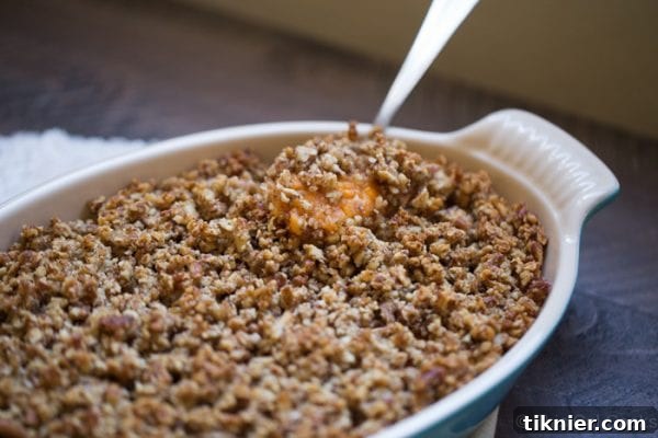 A dish of sweet potato enchiladas skillet casserole, showcasing a savory twist on sweet potatoes.