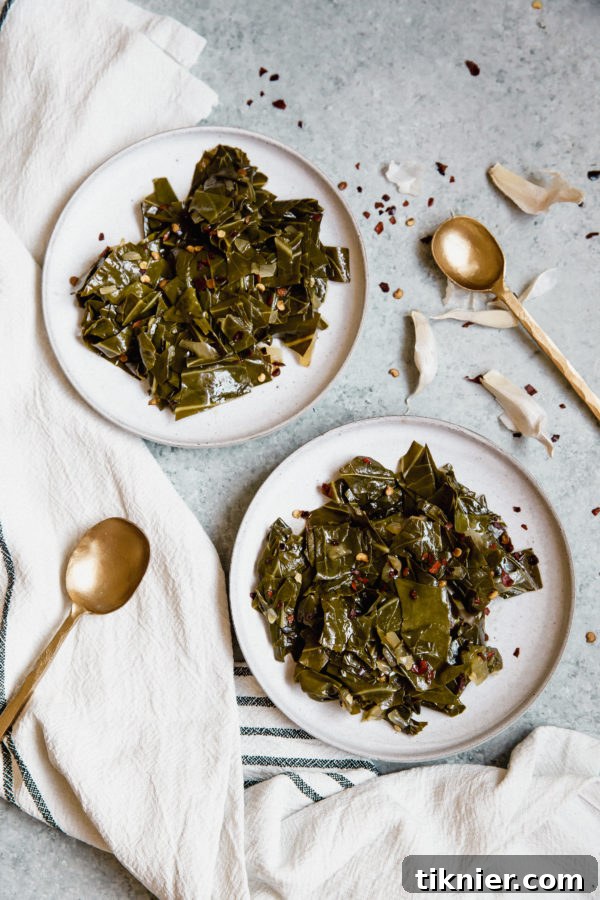 A large pot of Southern collard greens, slow-cooked with bacon, a traditional and flavorful dish.