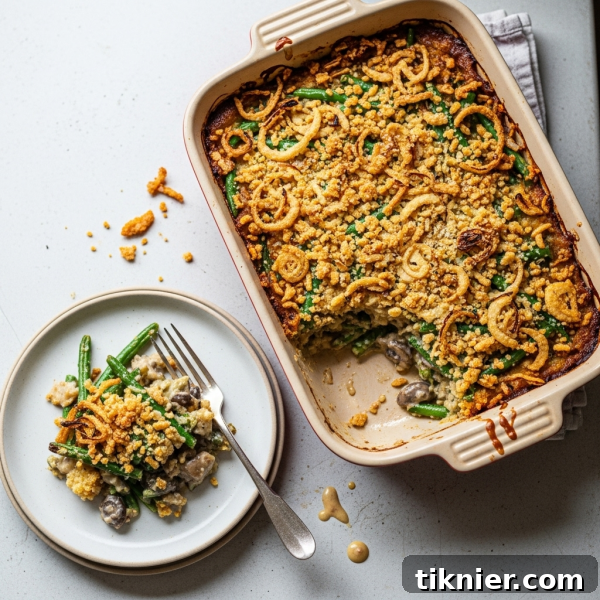 Traditional Green Bean Casserole with a creamy mushroom sauce and crispy fried onion topping.