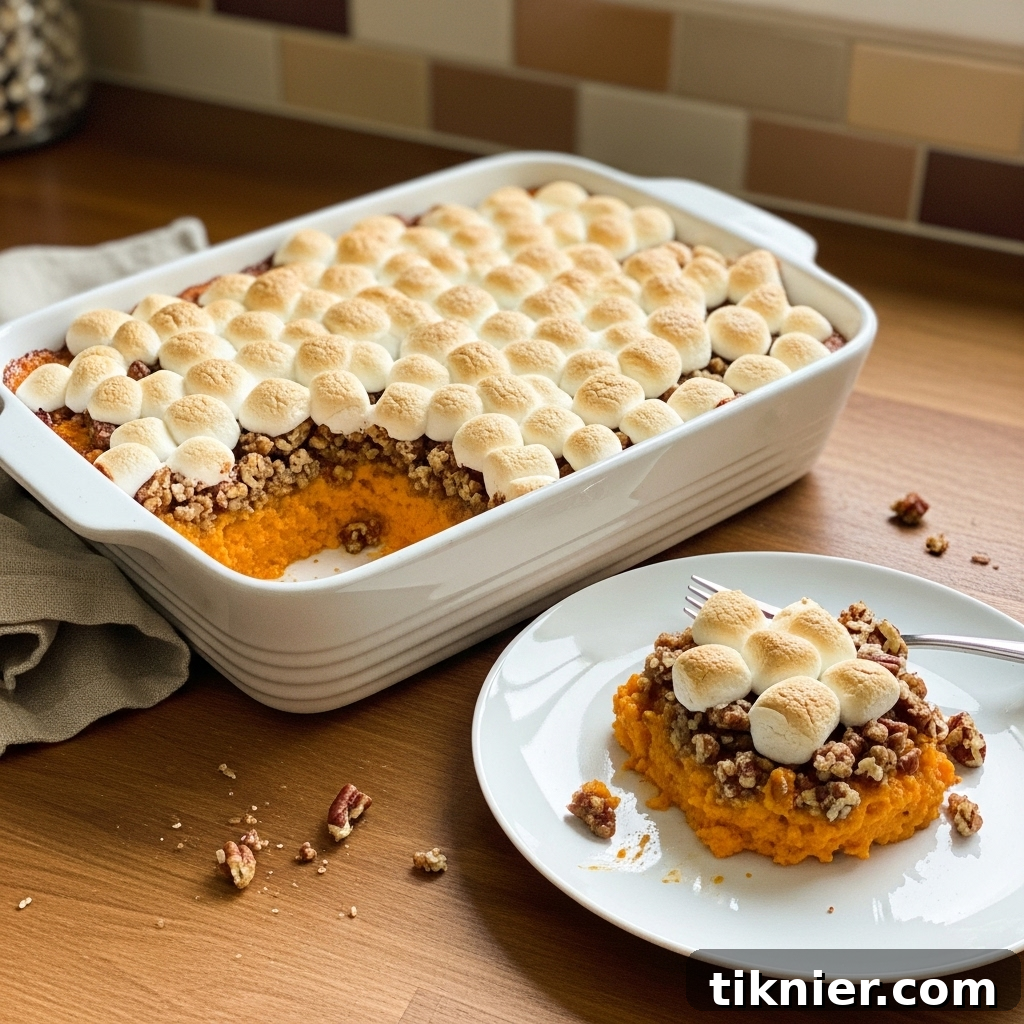 Sweet Potato Casserole with Toasted Marshmallows: A Thanksgiving Tradition 2 A beautifully baked Yams with Marshmallows casserole, golden brown and perfectly toasted marshmallows on top