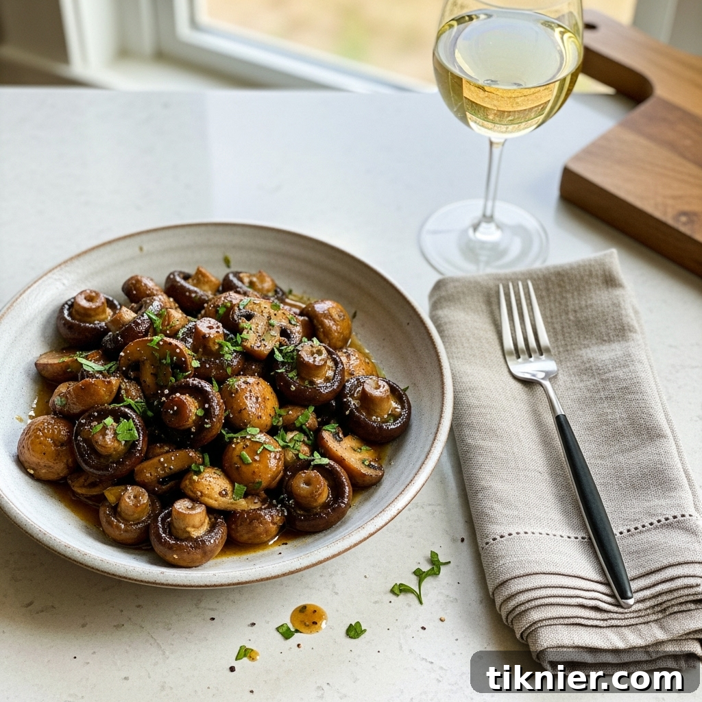Mouth-watering plate of golden-brown miso-butter sautéed mushrooms garnished with fresh parsley.