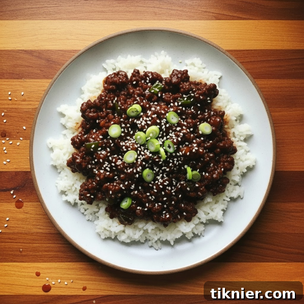 Mongolian Ground Beef A Quick Weeknight Meal 3 A close-up of the Mongolian Ground Beef recipe in a skillet, showcasing the rich sauce, tender beef, and vibrant green onions.
